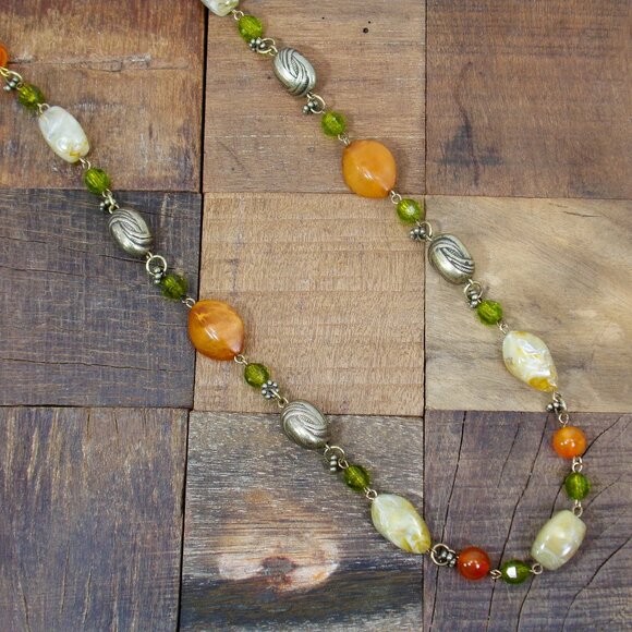 Multi color bead necklace with a mix of beige, green, and deep orange tones. - Picture 8 of 11